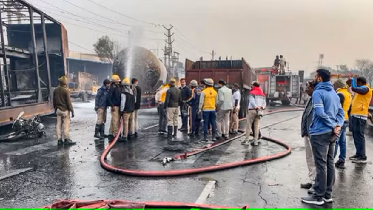 Firefighters extinguish the fire at the site of the accident