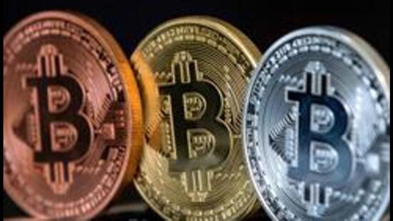 A picture taken on February 6, 2018 shows a visual representation of the digital crypto-currency Bitcoin, at the "Bitcoin Change" shop in the Israeli city of Tel Aviv